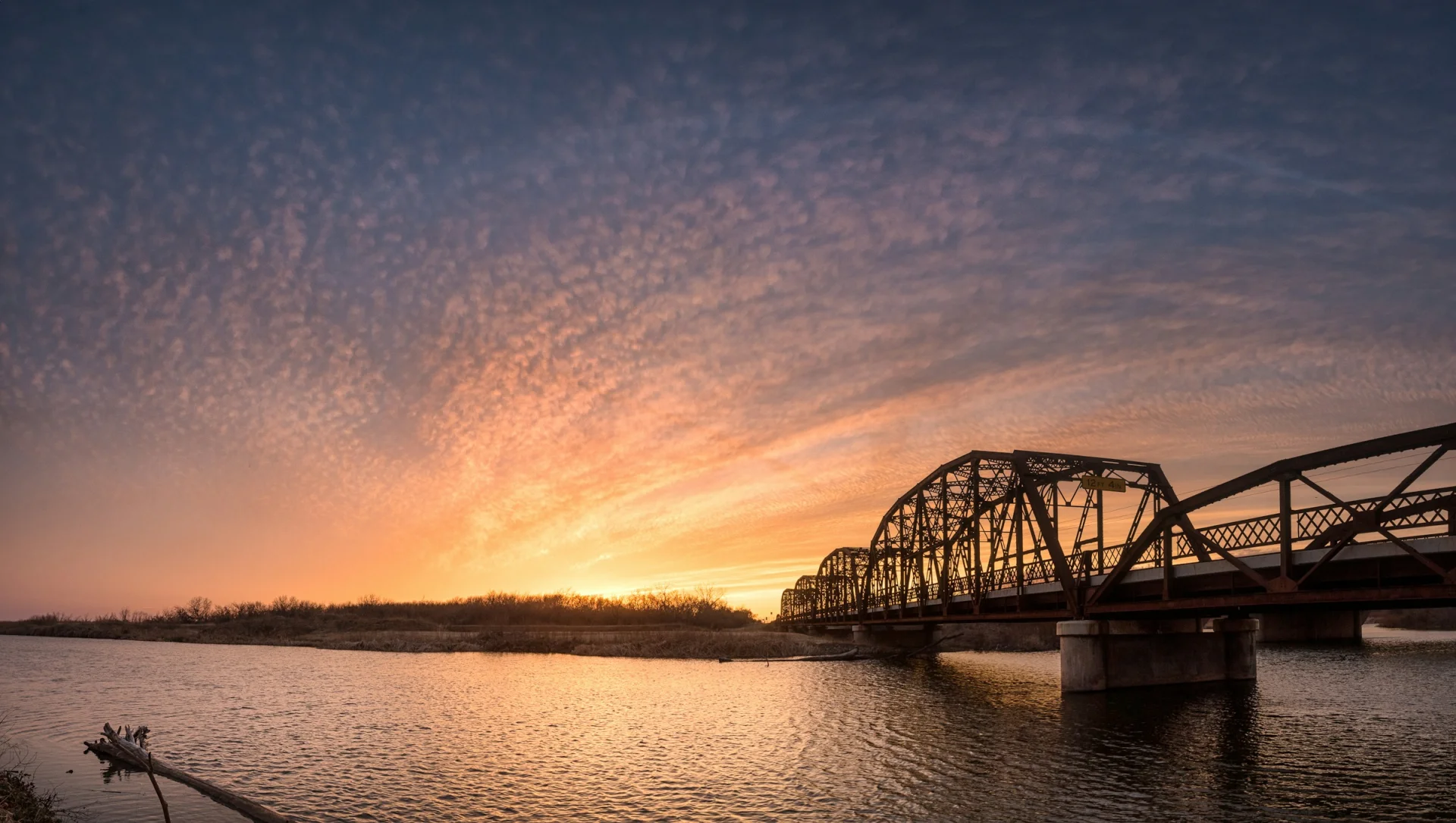 Lake Overholser and the historic Route 66 bridge at sunset in Oklahoma City.